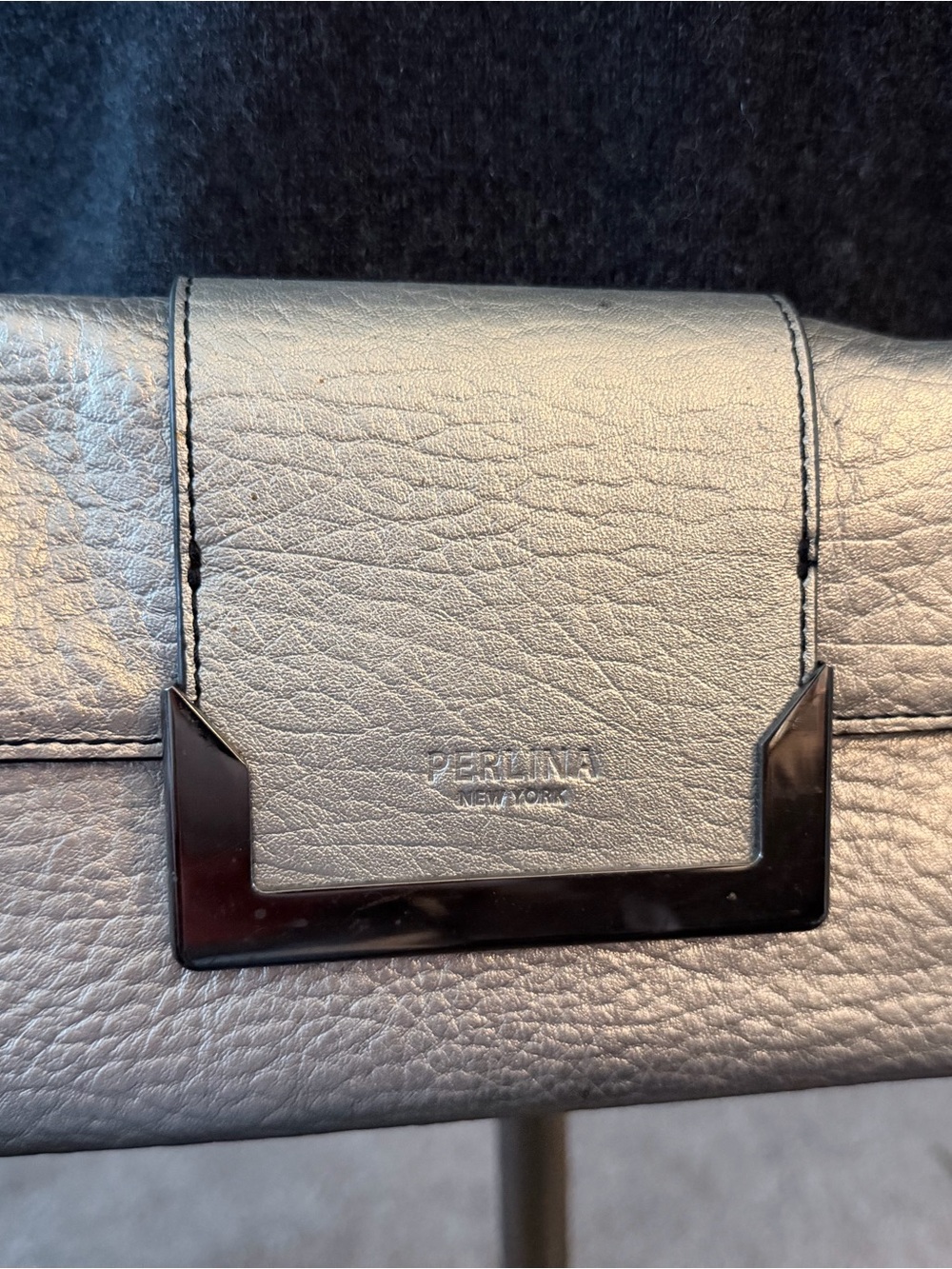 Perlina Gray Pebbled Leather Clutch with Dark Polished Accent